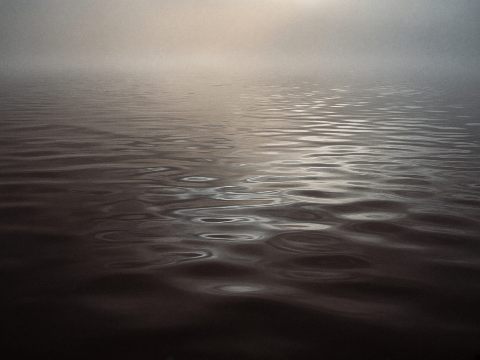Still dark water at dawn